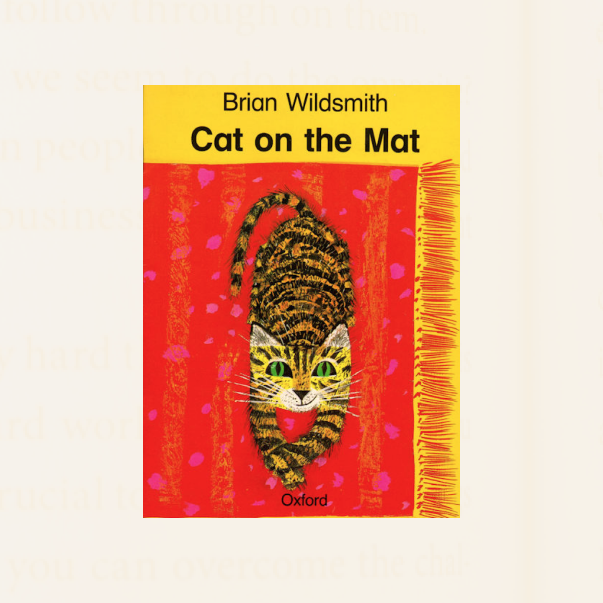 bright yellow band with title text Cat on the Mat above a red rectangular rug covering the page. A smiling striped yellow cat with green eyes lies on the rug with paws outstretched facing the reader.